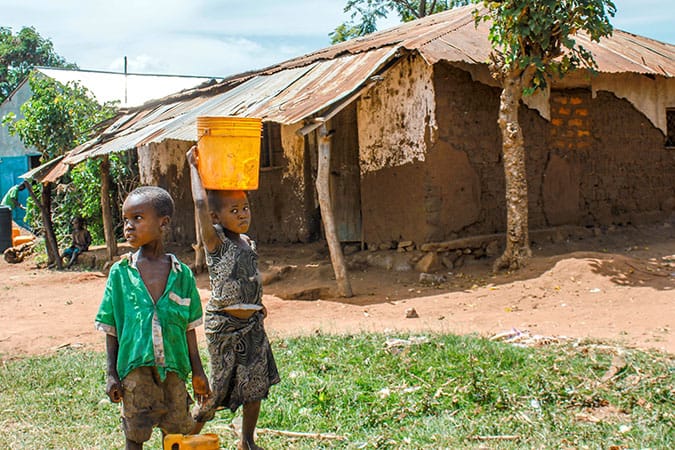 Water: Carrying the Burden - Children Carrying Water Buckets