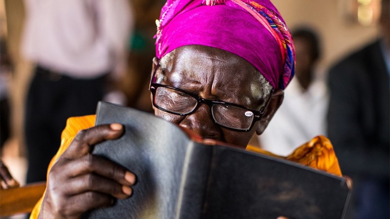 20D173 Gladys_Bible Gladys reads the Bible with her new glasses