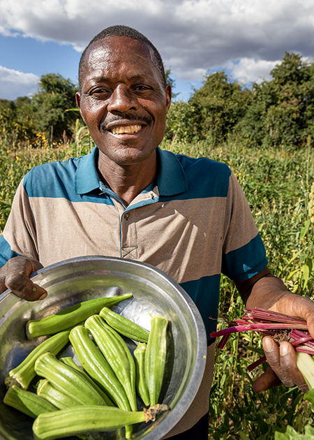 AgEmail-landingpg-main-photo (1) man holds okra